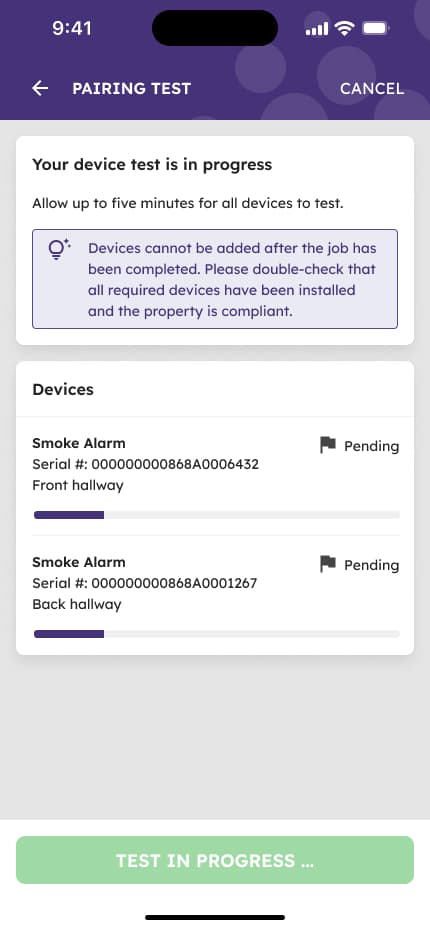Mobile app screen showing device pairing test in progress with visual feedback indicator